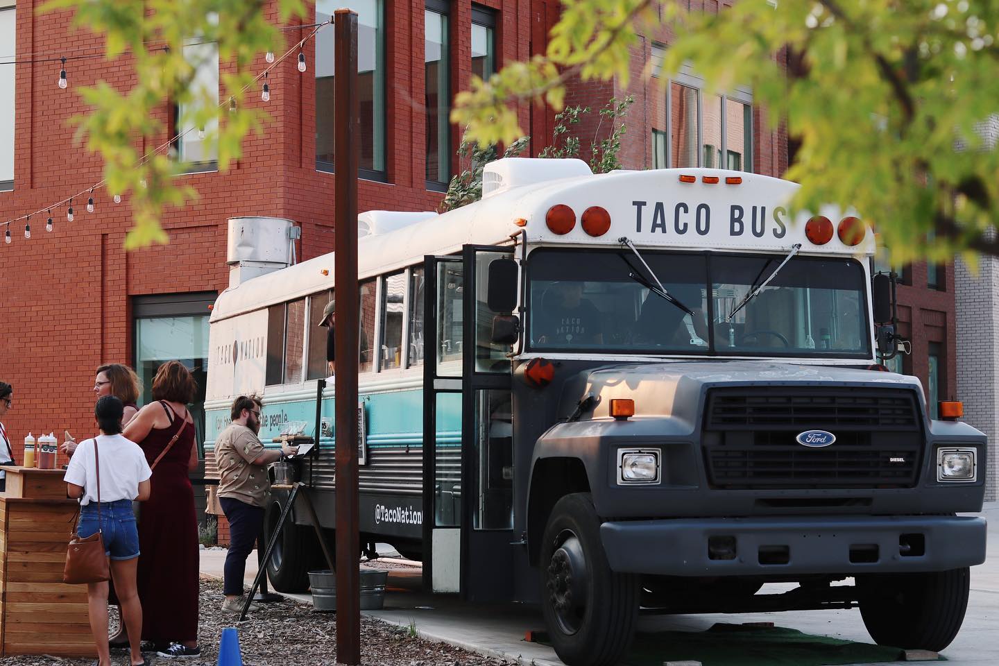 Taco Nation food bus parked on Spoke St. in Wheeler District