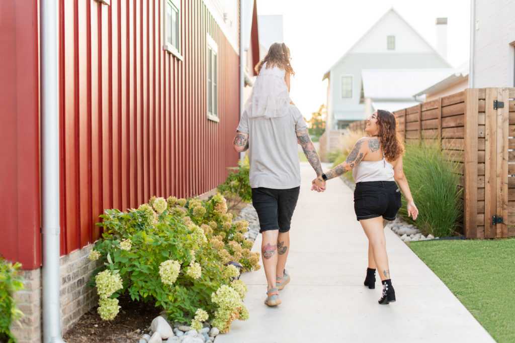 Family walking down an alley in Wheeler District OKC